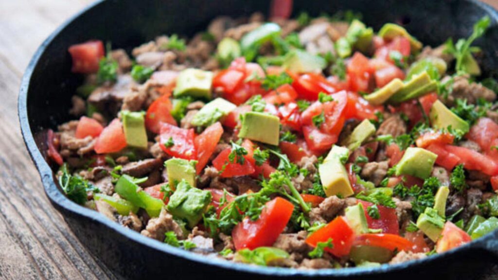 A cast iron pan filled with this Turkey Vegetable Skillet Recipe.
