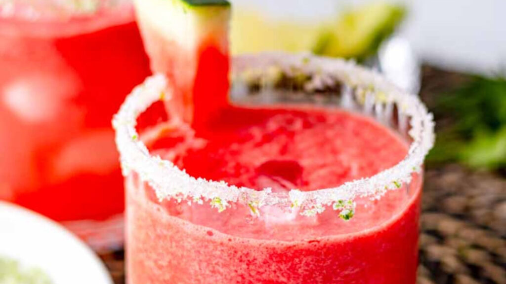 Closeup of a glass filled with watermelon mocktail.