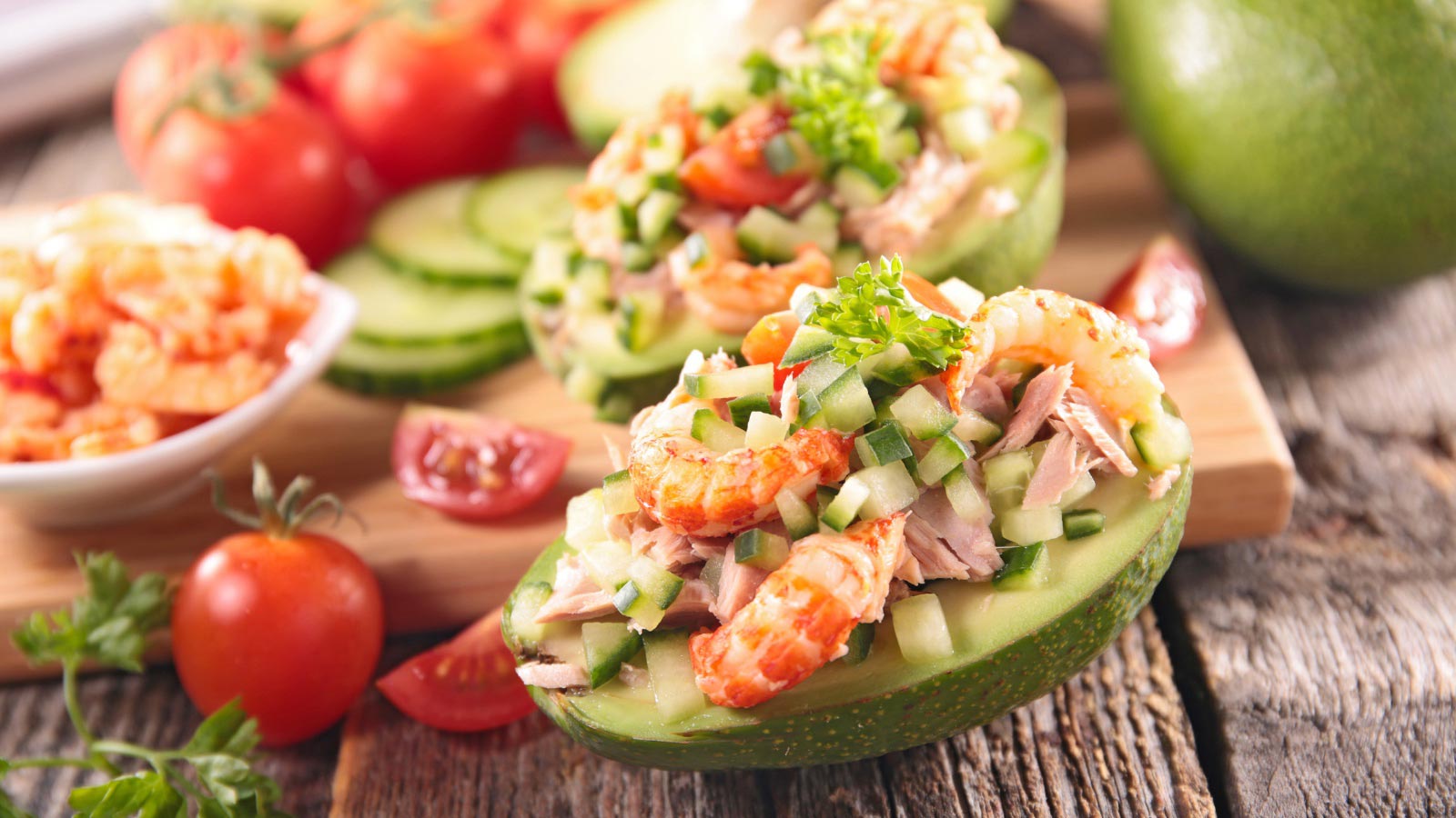 avocado salad and ingredients served in half avocados.
