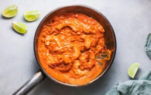 Shrimp curry sauce in a skillet.