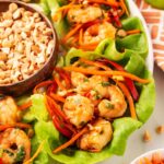 A partial view of a large platter of Thai Shrimp Lettuce Wraps.