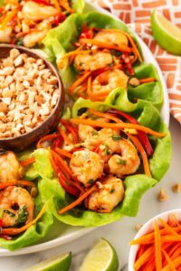 A partial view of a large platter of Thai Shrimp Lettuce Wraps.