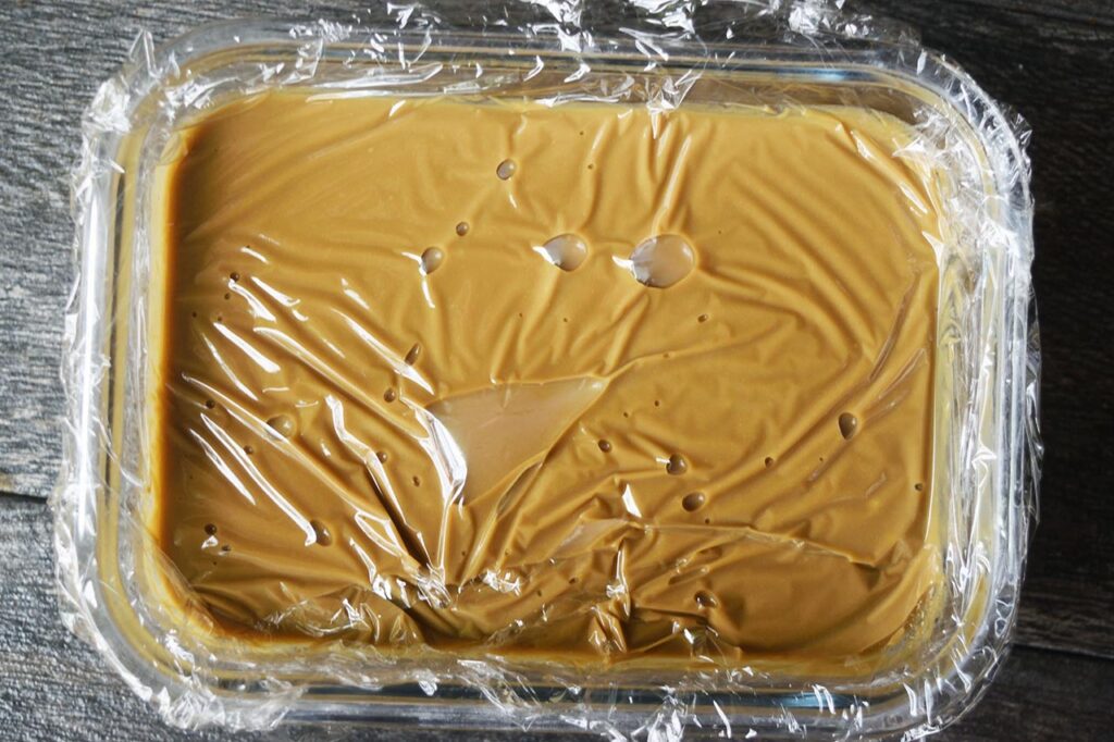 Coffee Ice Cream batter covered in plastic wrap.