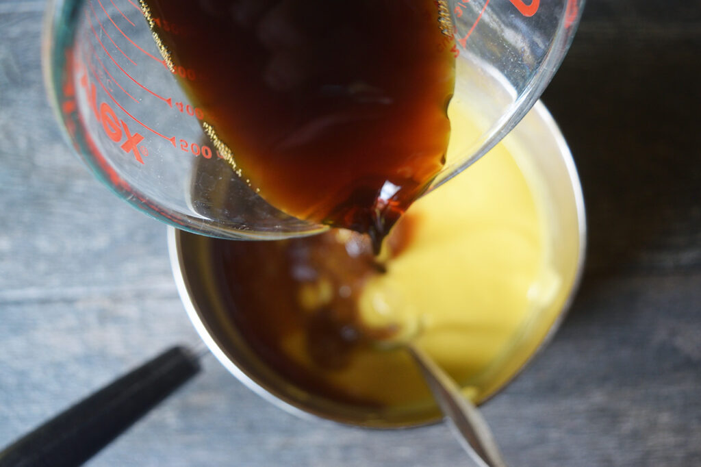 Pouring coffee into the ice cream batter.