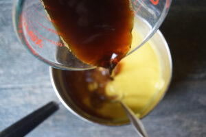 Pouring coffee into the ice cream batter.
