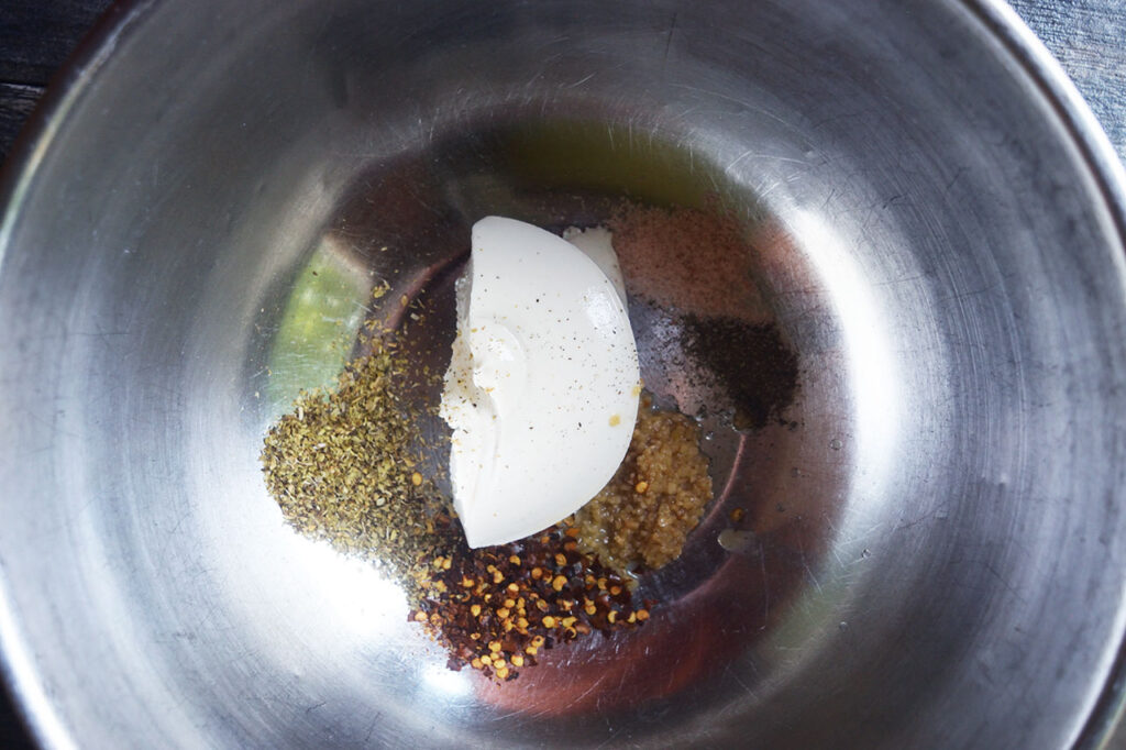 Creamy filling ingredients sitting in a mixing bowl.