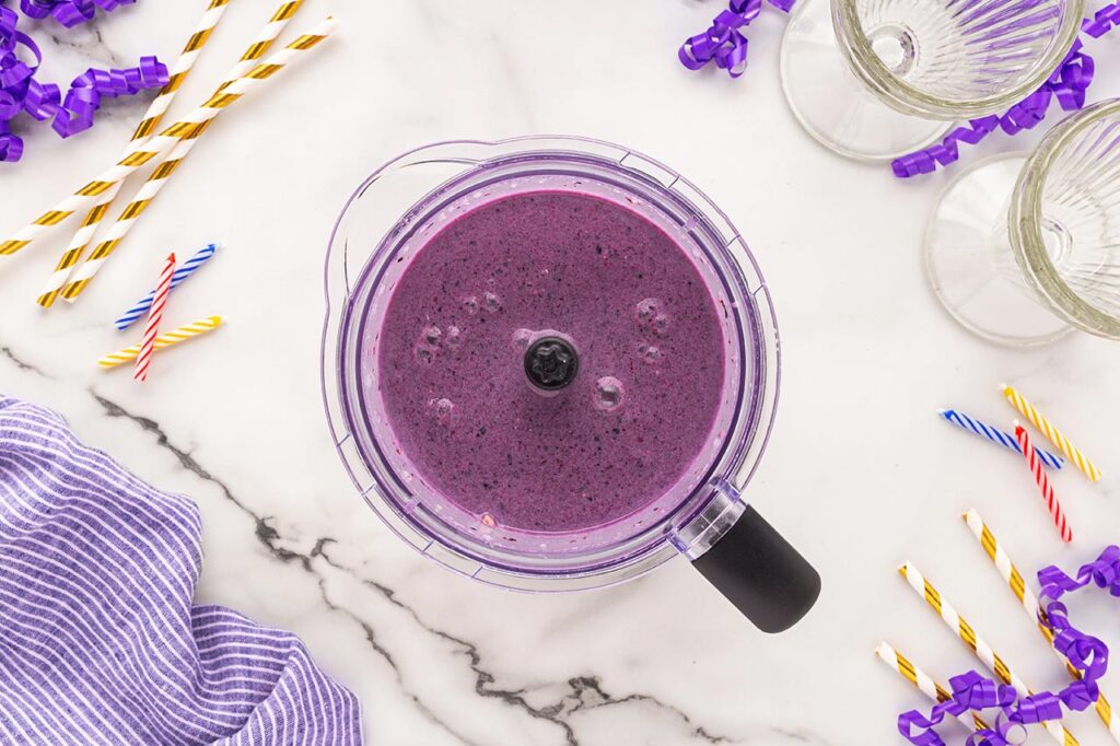 Blended Grimace Shake in a blender tumbler.