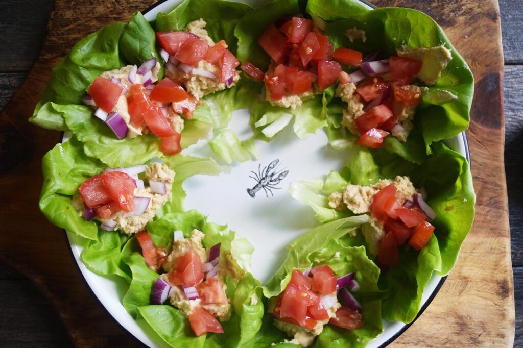 Tomatoes sprinkled onto Mediterranean Lettuce Wraps.