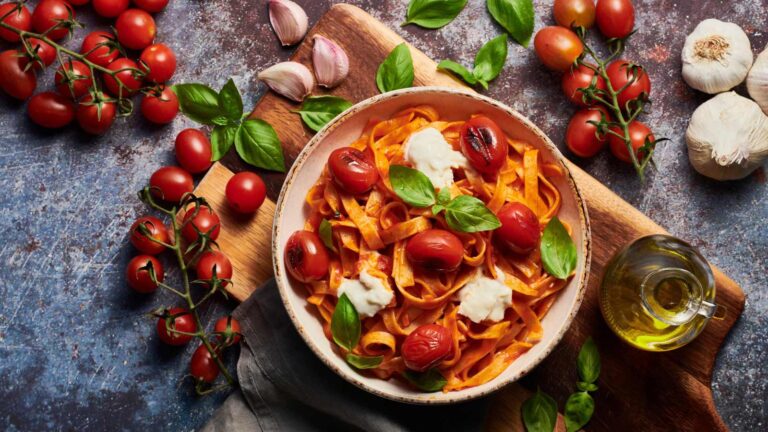 Delicious pasta dish with tomatoes and fresh basil.