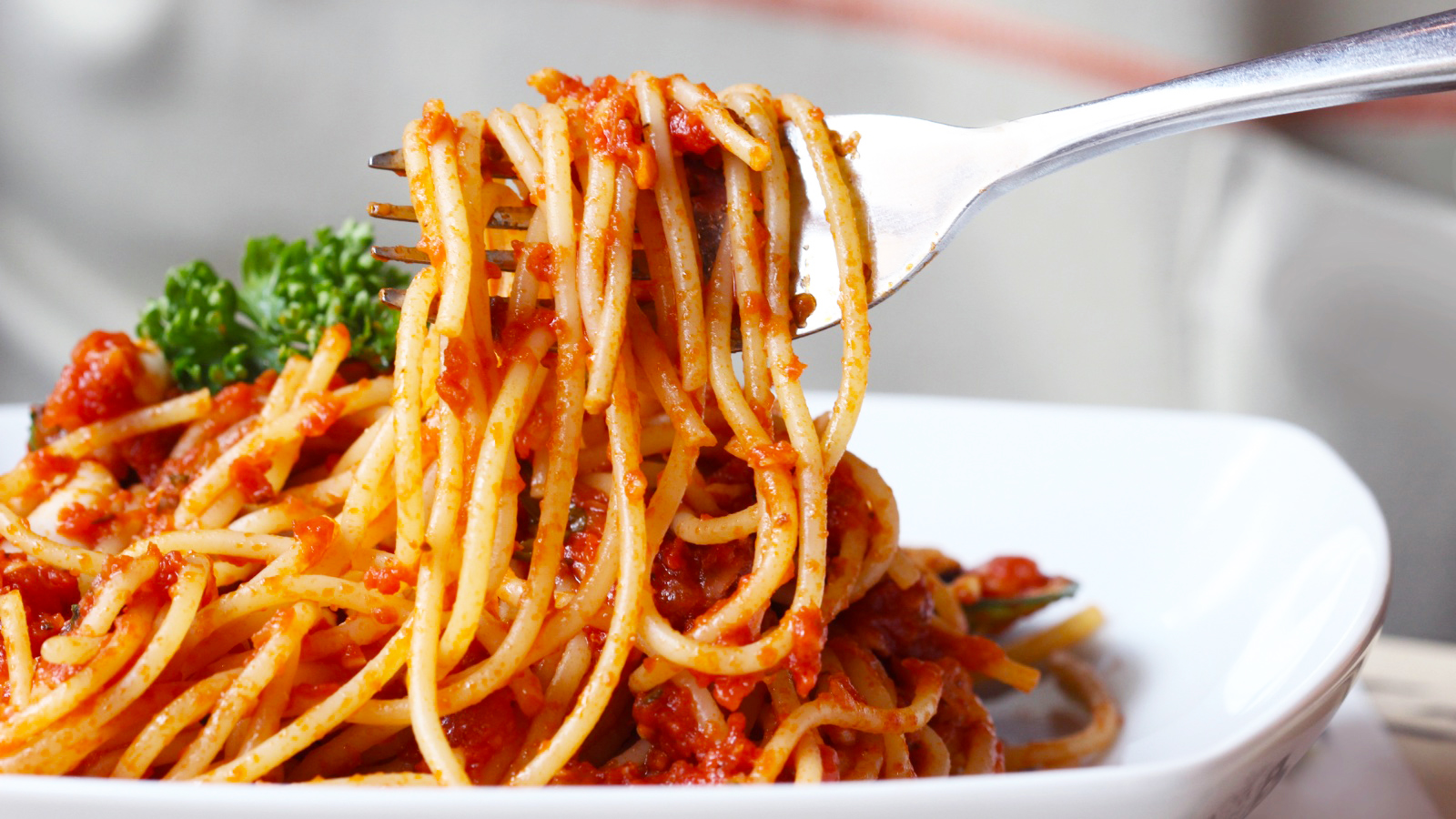 Fresh spaghetti with tomato sauce close up.
