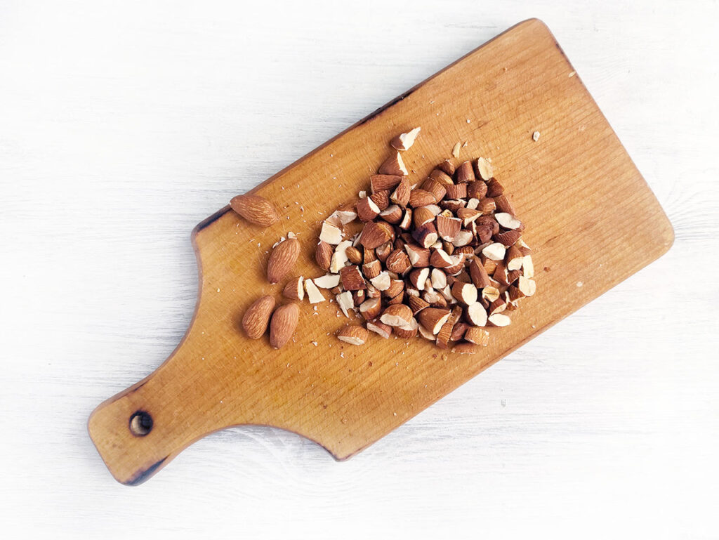 Chopped almonds on a cutting board.