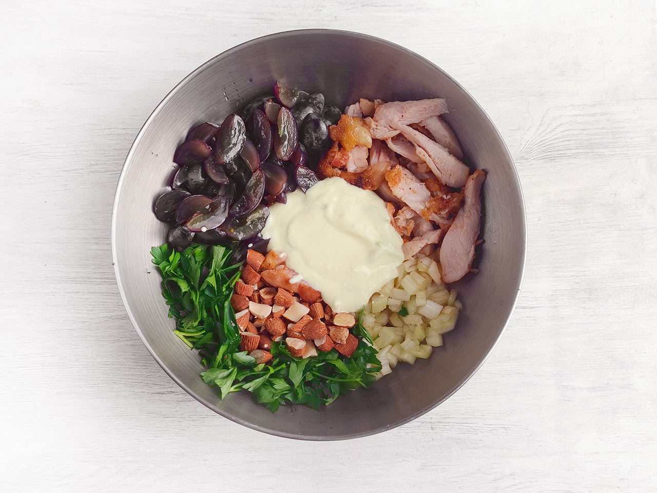 Chicken Salad ingredients in a mixing bowl waiting to be mixed.