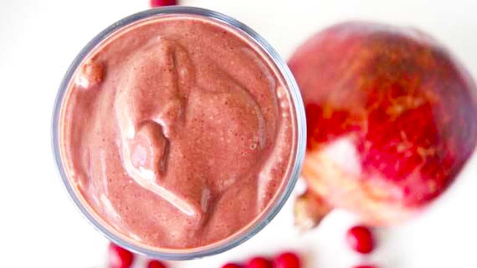 Overhead view of a glass filled with chocolate cranberry smoothie.