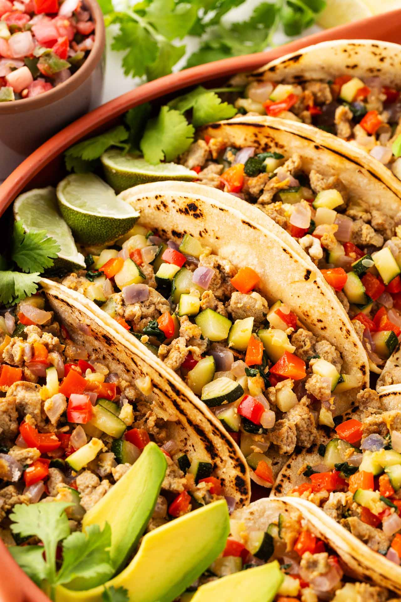 Closeup of tacos prepared and served in a casserole dish.