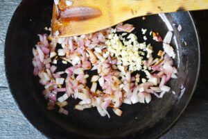 Sautéd onions in a skillet with minced garlic.