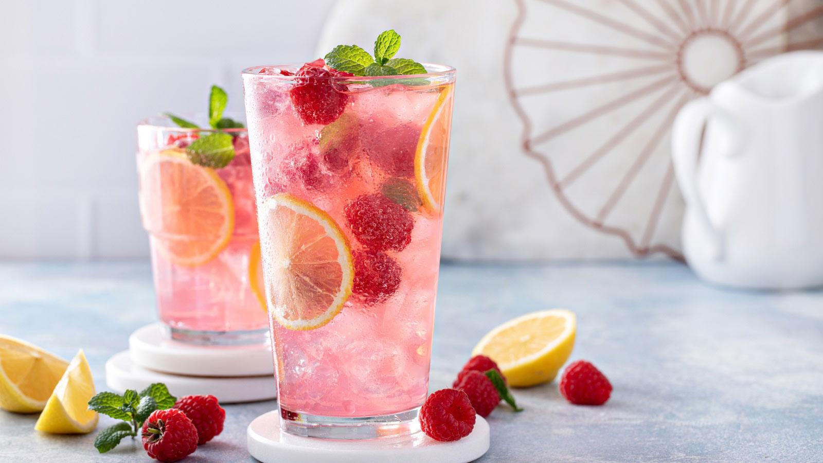 Spring or summer refreshing cold cocktail or mocktail with berries and lemon, raspberry lemonade.