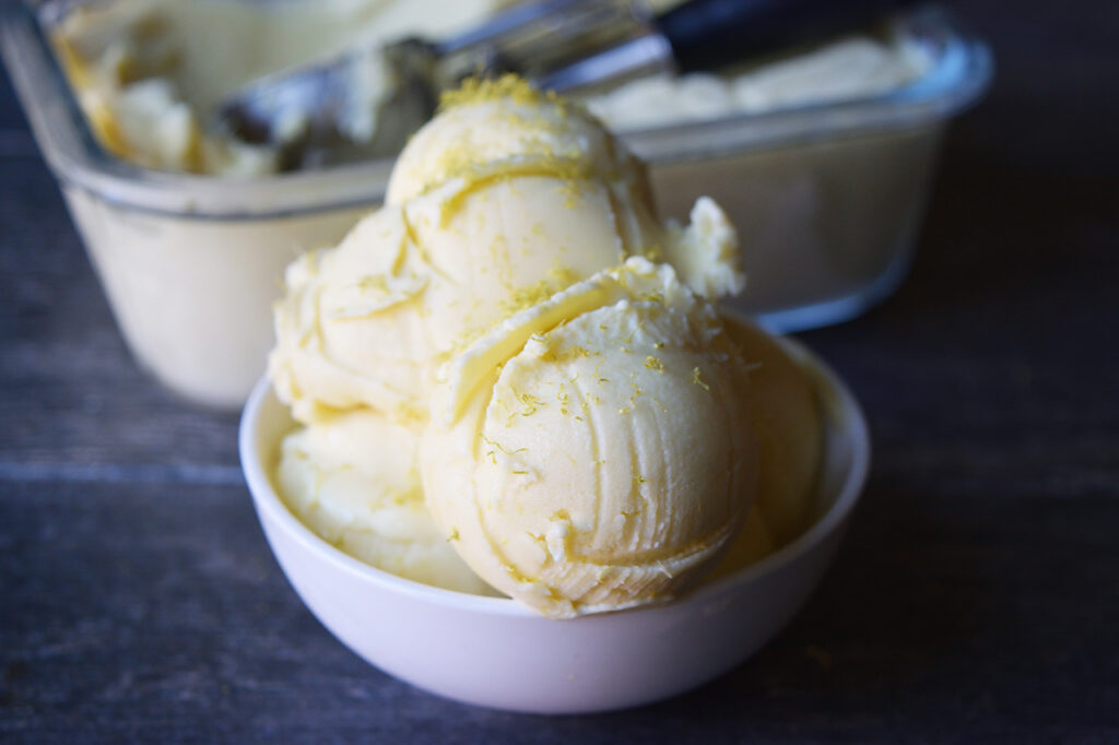 Scoops of Thai coconut ice cream in a white bowl.