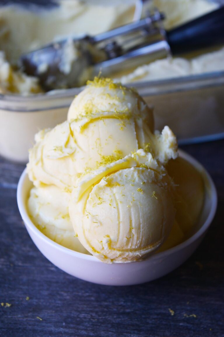 Front focus of white bowl with several scoops of Thai Coconut Ice Cream in it.