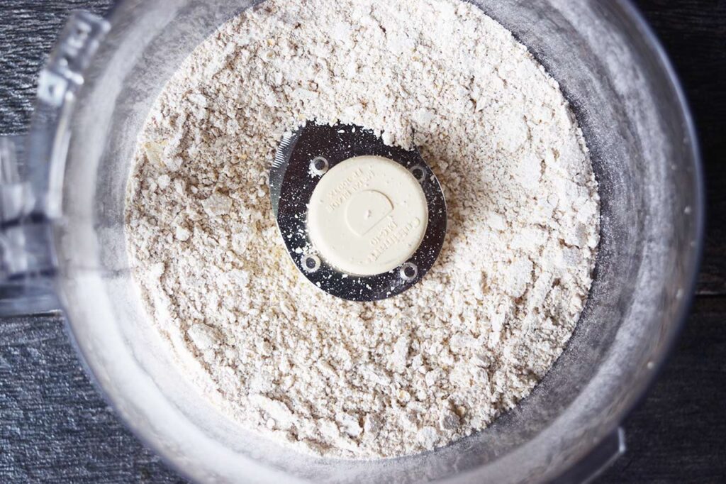 Crust ingredients in a food processor bowl.