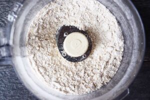 Crust ingredients in a food processor bowl.