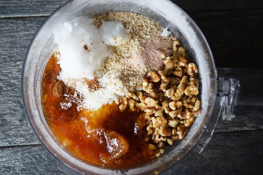 Remaining crust ingredients added to food processor bowl.