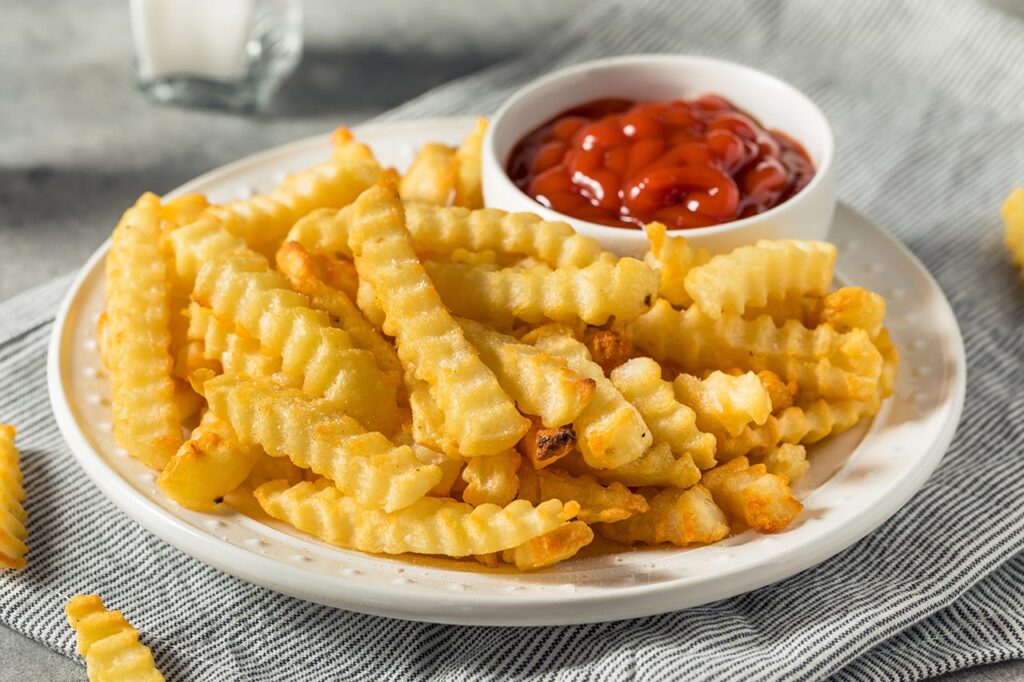Homemade Crinkle Cut French Fries with Ketchup.