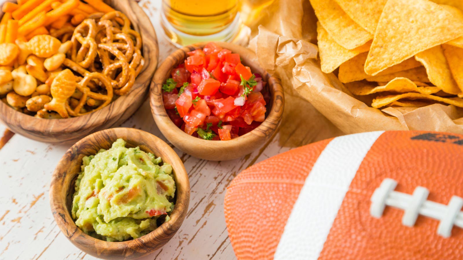 Game day finger foods for game night. Chips, salsa, guacamole.