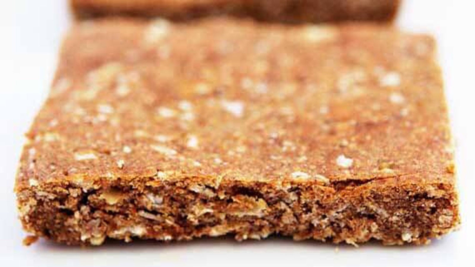 A Pumpkin Spice Protein Bar on a white surface.