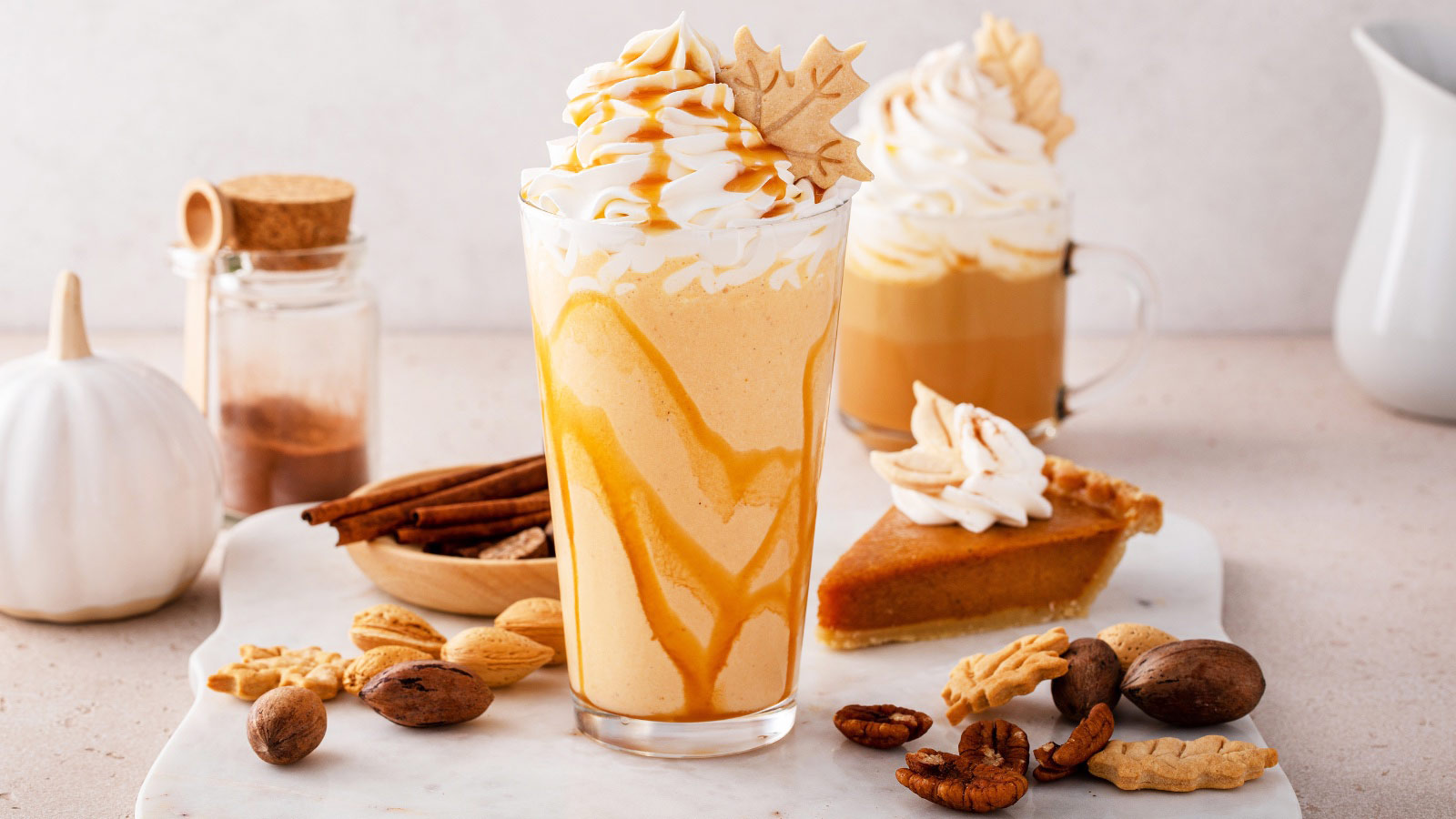 Pumpkin pie smoothie with maple syrup and whipped cream on top