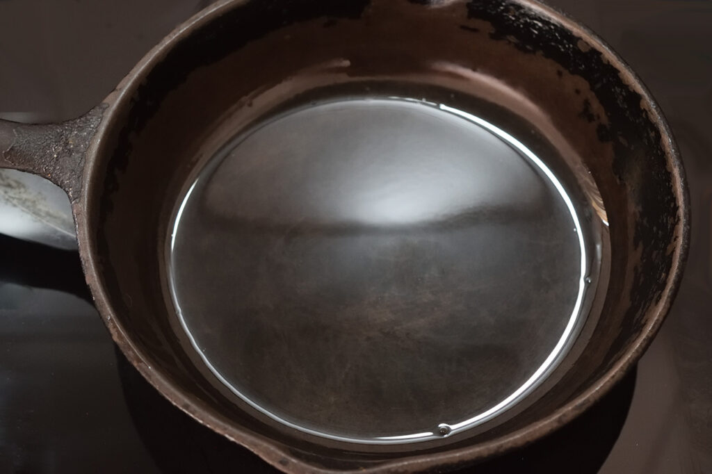 An oiled cast iron skillet.