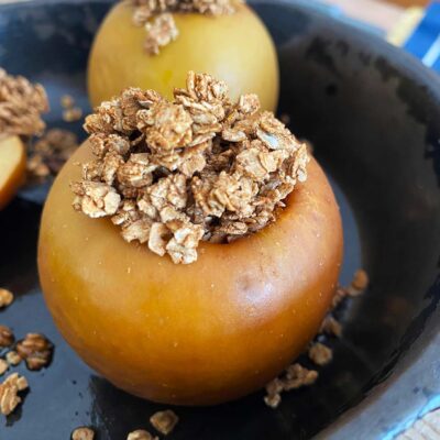 Front view of baked apple in a skillet.
