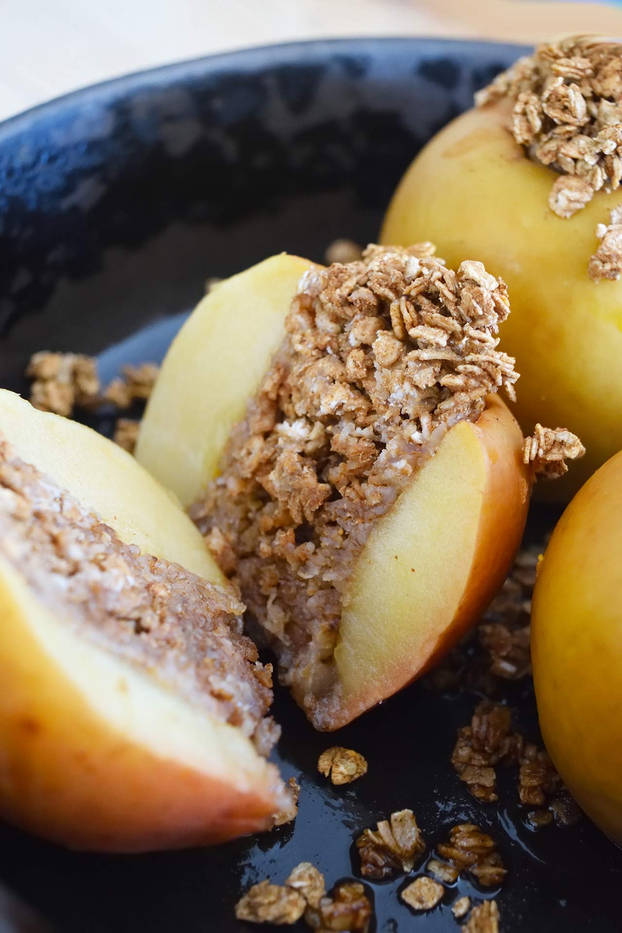 A baked apple cut in half lengthwise.