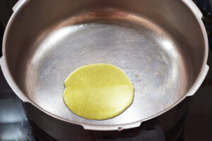 Oil warming in a pot.