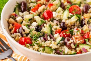 Closeup of a white bowl filled with Greek Rice.