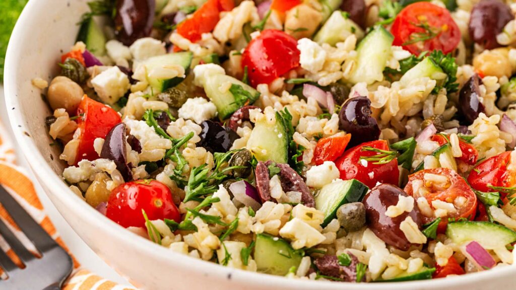 Closeup of a white bowl filled with Greek Rice.
