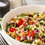 Side view of a Greek Rice Bowl on a table.