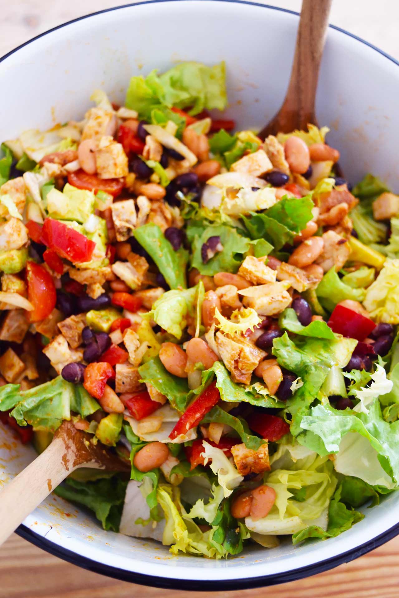 Overhead view of a large mixing bowl filled with Mexican Dense Bean Salad.