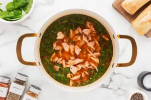 Salmon added back into soup pot.