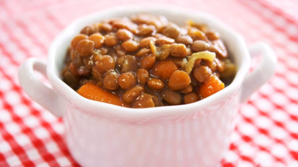 A white bowl filled with Slow Cooker Lentil Soup.