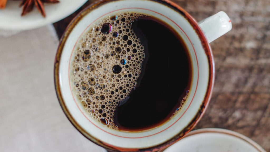 Overhead view looking down into a mug filled with chai coffee.