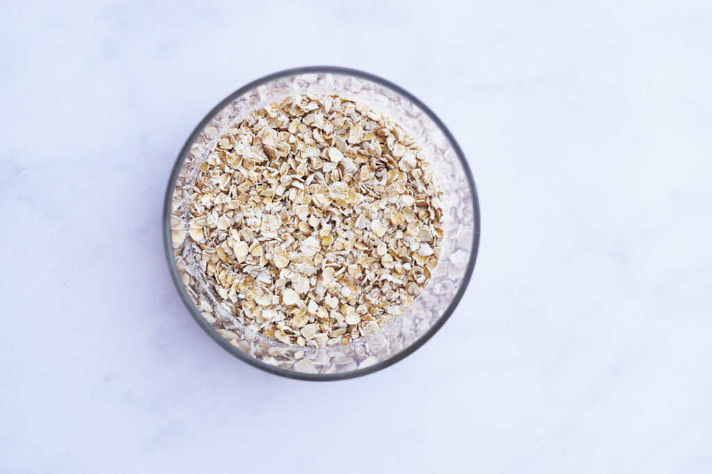 Dry oats in a glass jar.