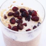 Cranberry Overnight Oats in an open glass jar.