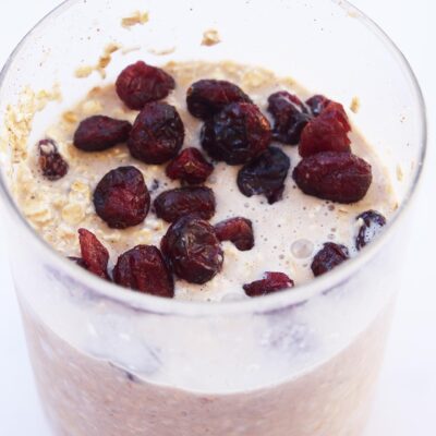 Cranberry Overnight Oats in an open glass jar.