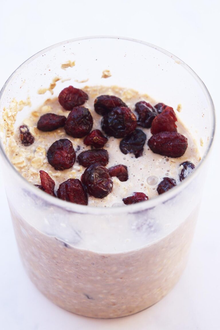 Cranberry Overnight Oats in an open glass jar.