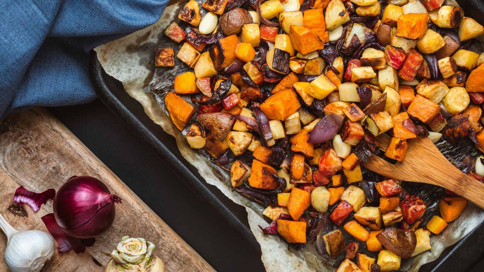 Roasted root vegetables on a baking sheet.