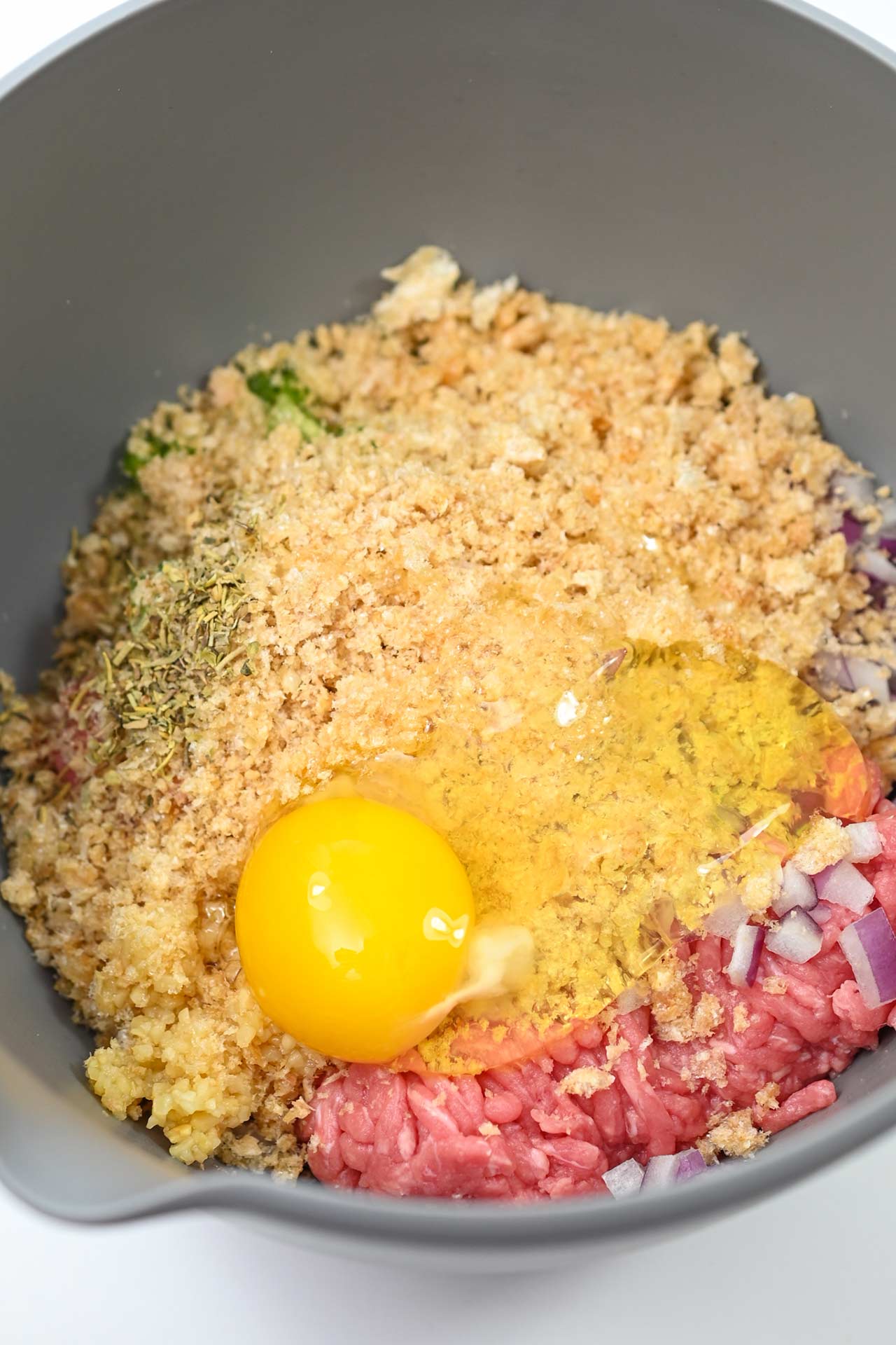 Air Fryer Meatball ingredients combined in a mixing bowl.