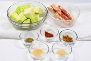 Bacon-Wrapped Zucchini Recipe ingredients in individual bowls.