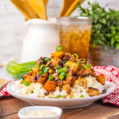 Counter-level view of a bowl filled with Pineapple Chicken and rice.