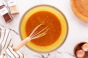 Pumpkin Pie batter in a mixing bowl.