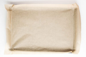 A sheet pan lined with parchment paper.